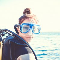 Portrait of a young girl diver on a sunny day